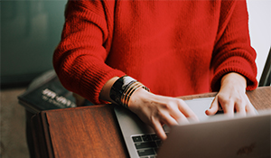 Woman typing on laptop